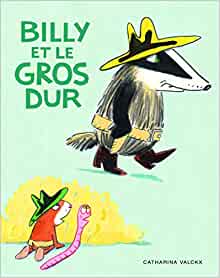 Couverture du livre 'Billy et le gros dur' montrant un blaireau avec un chapeau et une ceinture, marchant à côté d'un petit personnage rouge avec un ver de terre.
