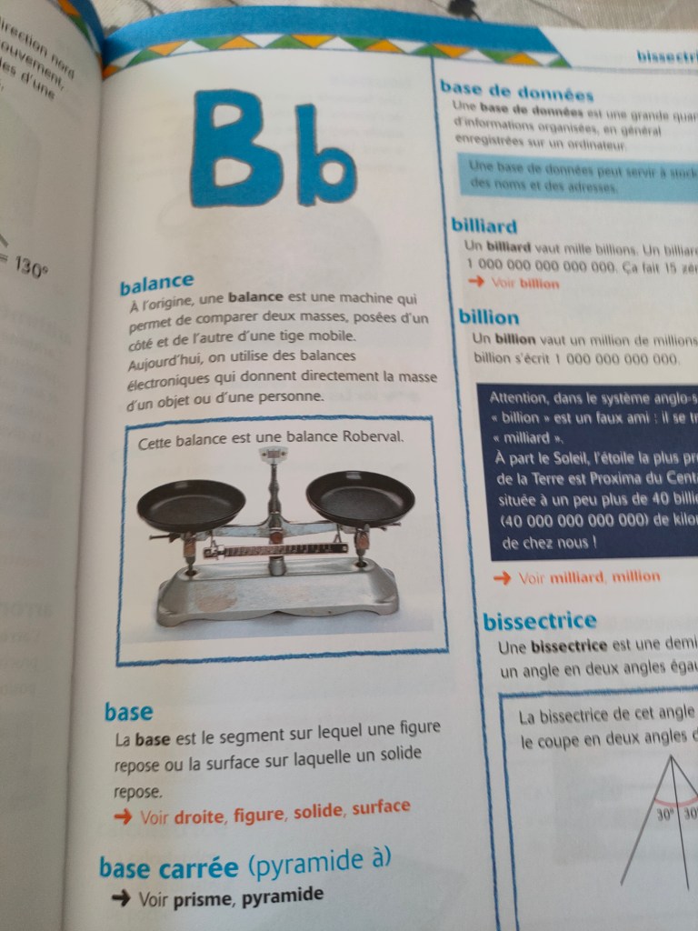 Page d'un livre sur les balances, présentant une balance Roberval avec des définitions de termes liés à la mesure et la géométrie.