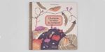 Couverture d'un livre illustré avec des motifs colorés de plantes et d'animaux.
