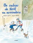 Couverture du livre 'Un cadeau de Noël en novembre' avec deux enfants jouant dans la neige et un chat.