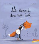 Couverture d'un livre illustré intitulé 'Un renard dans mon école', montrant un enfant marchant avec un renard souriant dans un paysage automnal.